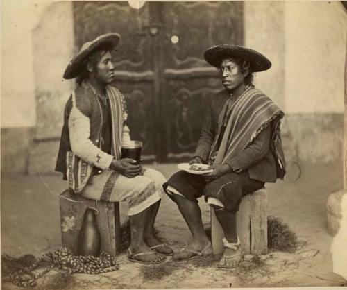 Studio portrait of two men sitting