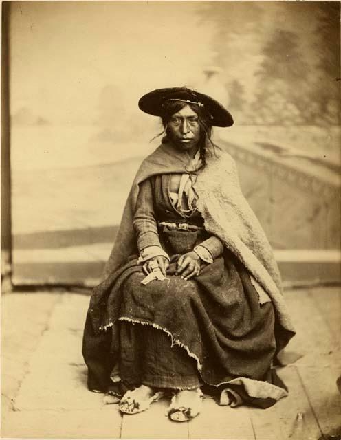 Studio portrait of woman sitting