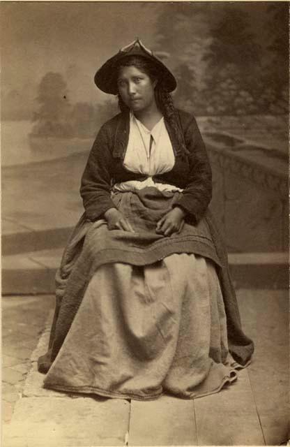 Studio portrait of woman sitting