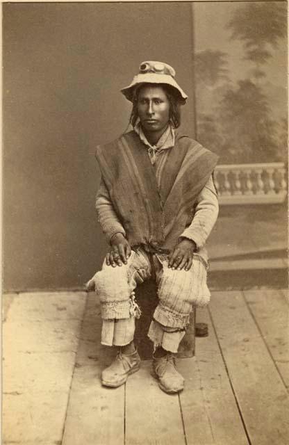 Studio portrait of man sitting