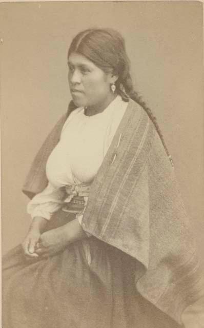 Studio portrait of woman sitting