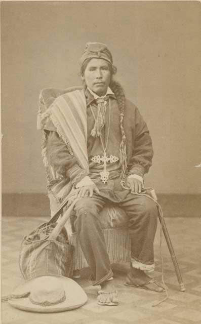 Studio portrait of man sitting