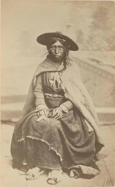 Studio portrait of woman sitting