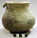 Small corrugated pottery jar