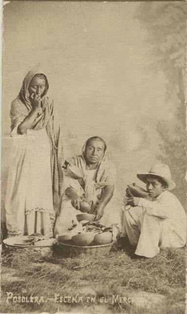 Studio portrait of two women and man