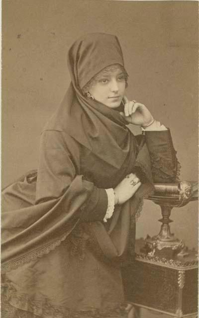 Studio portrait of woman sitting