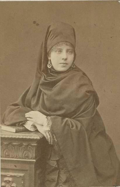 Studio portrait of woman sitting