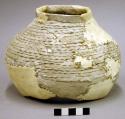 Corrugated pottery jar--restorable?