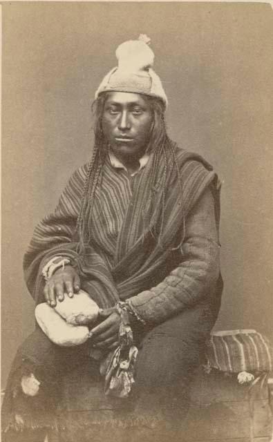 Studio portrait of man sitting