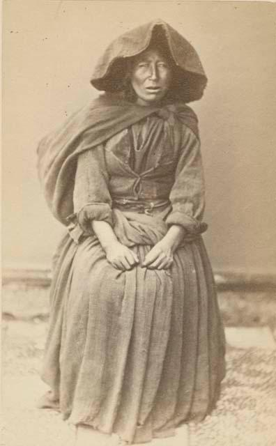 Studio portrait of woman sitting