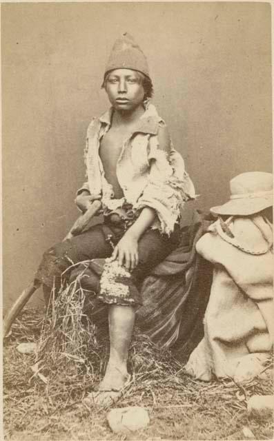 Studio portrait of boy sitting