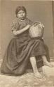 Studio portrait of woman with basket