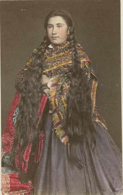 Studio portrait of woman standing