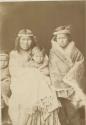 Studio portrait of man and three children