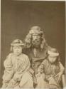 Studio portrait of man and two children