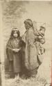 Studio portrait of a woman with two children