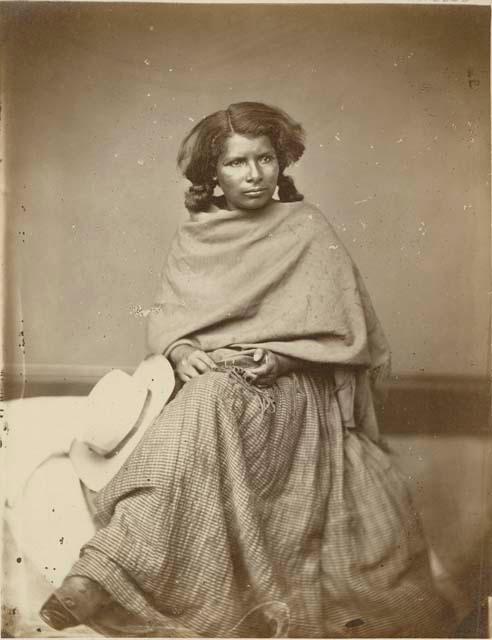 Studio portrait of woman sitting