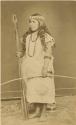 Studio portrait of woman with bow and arrows