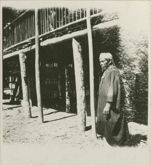 Man standing next to a structure