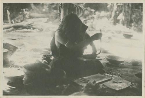 Woman making a clay pot