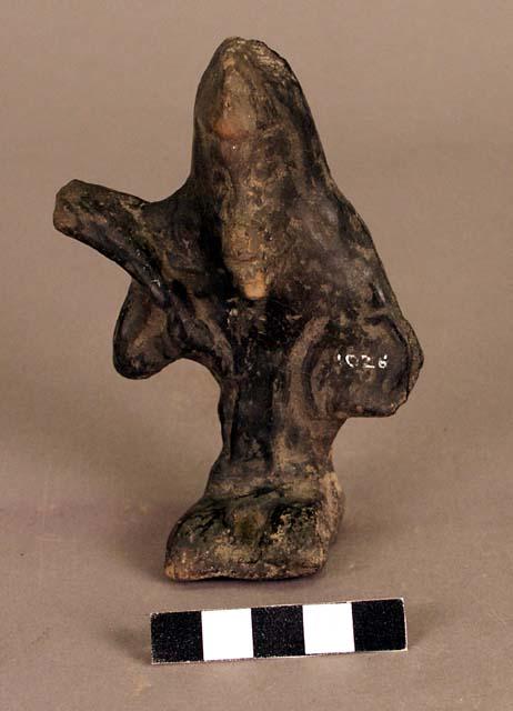 Human figure with head of monkey