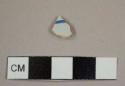 Tin-glazed earthenware sherd with handpainted blue-on-white decoration and light buff paste