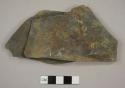 Fieldstone fragment, possibly from drain feature