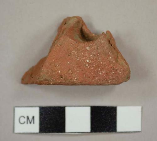 Brick roof tile fragment with a broken nail hole 1.4 cm diameter outside and 1.0 cm inside
