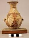 Small olla-shaped pottery jar with pierced lugs--sillustani polychrome+