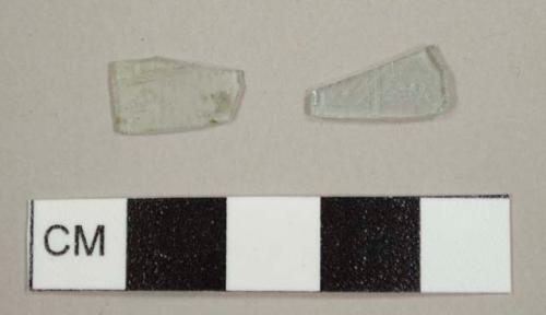 Aqua glass fragments, one flat fragment and one curved fragment, most likely from a lamp chimney