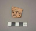 Painted potsherd (1.5" long)