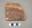 Painted potsherd (2.12" long)