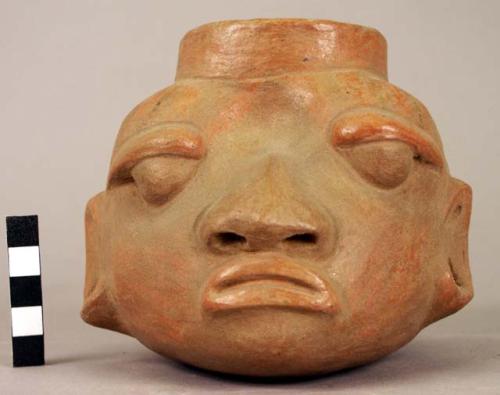 Pottery effigy vessel - brown with brownish red vertical bands exccept on face