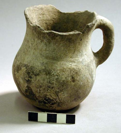 Black on white pottery jug