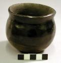 Small burnished black ware jar.