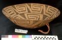 Large, bowl-shaped basket, coiled. Fibre bundle rather than stick. Willow wrap