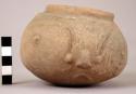 Small earthen jar, with face
