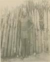 Man standing in front of fence