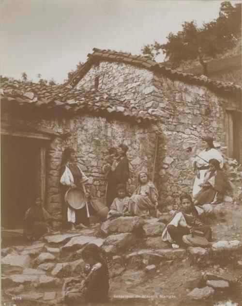 Children and adults outside of building