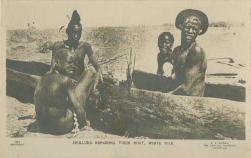 Group repairing a boat