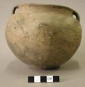 Ceramic vessel, six lobes, two handles, slightly flared short neck, cracks in ri