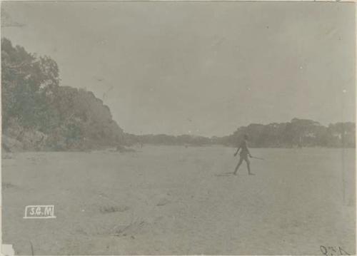 Man walking on bed of the Manambovo river