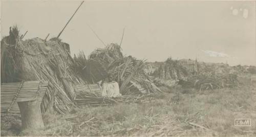 Person constructing huts