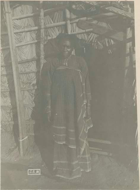 Woman standing in front of structure