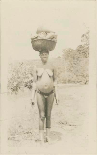 Woman carrying basket on her head