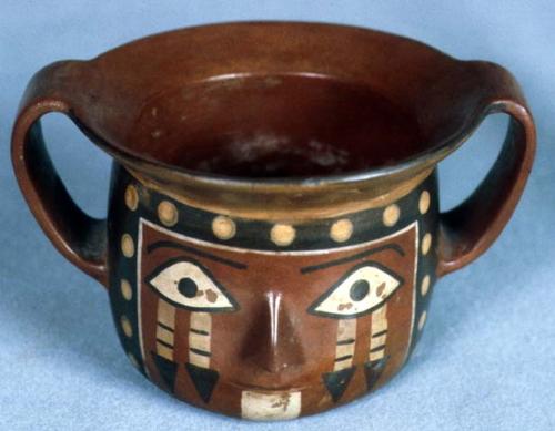 Two-handled cup painted and modeled with a face