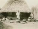 Man standing next to large ceramic pots