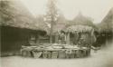 Rock structure in front of huts