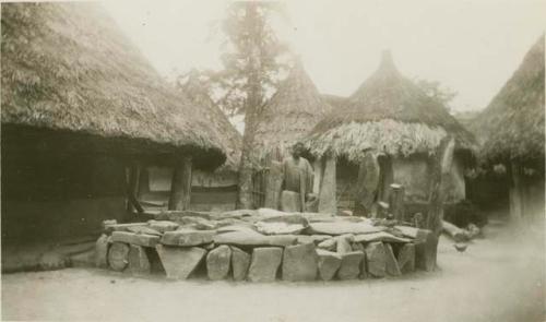 Rock structure in front of huts