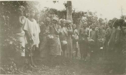 Group of people standing in front of trees